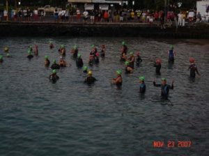 A group of people swimming in the water.