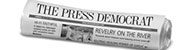 A newspaper with the words " press democrat " on it.